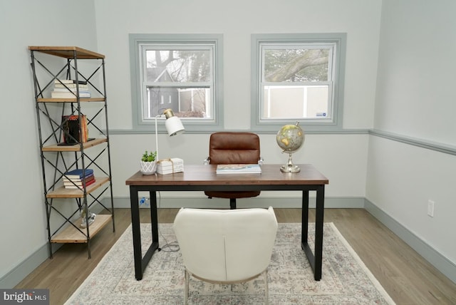 office featuring hardwood / wood-style flooring and plenty of natural light