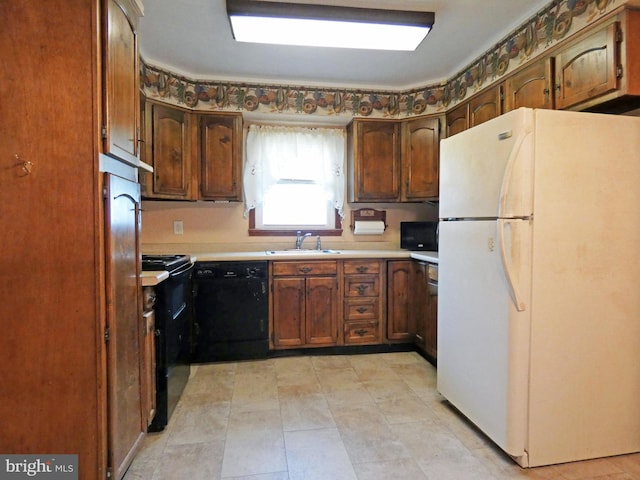 kitchen with sink and black appliances