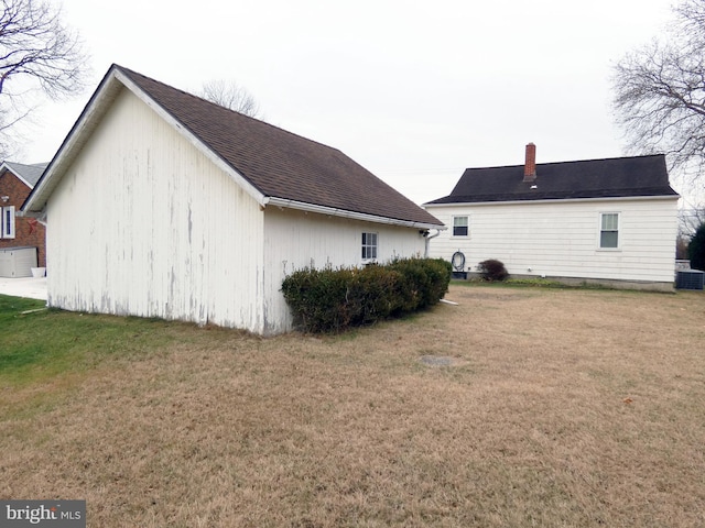 view of property exterior with a lawn