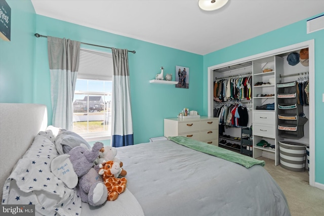 carpeted bedroom featuring a closet