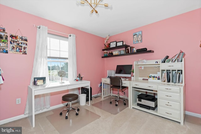 home office featuring light colored carpet and a notable chandelier