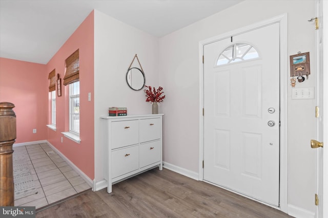 foyer entrance with hardwood / wood-style flooring