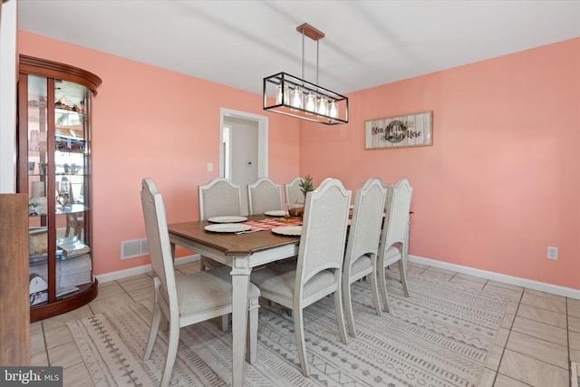 dining area with light tile patterned floors