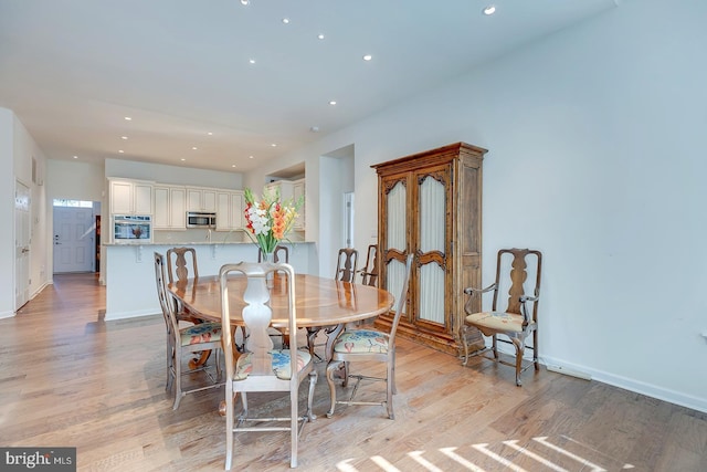 dining space featuring light hardwood / wood-style flooring