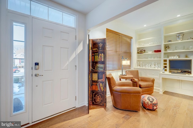 foyer featuring a healthy amount of sunlight and light wood-type flooring