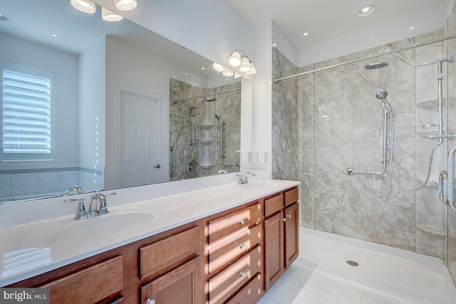 bathroom featuring vanity and a tile shower