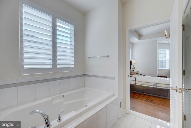 bathroom with tiled tub