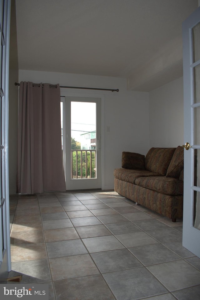 tiled living room with french doors