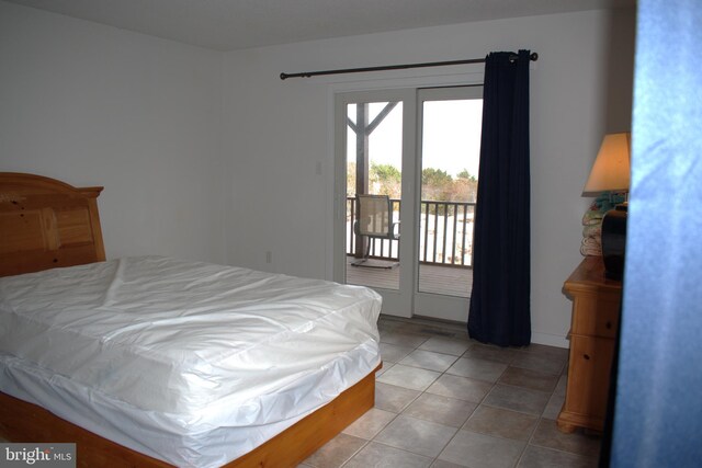 tiled bedroom with access to outside