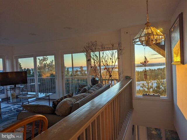 interior space featuring plenty of natural light and a notable chandelier