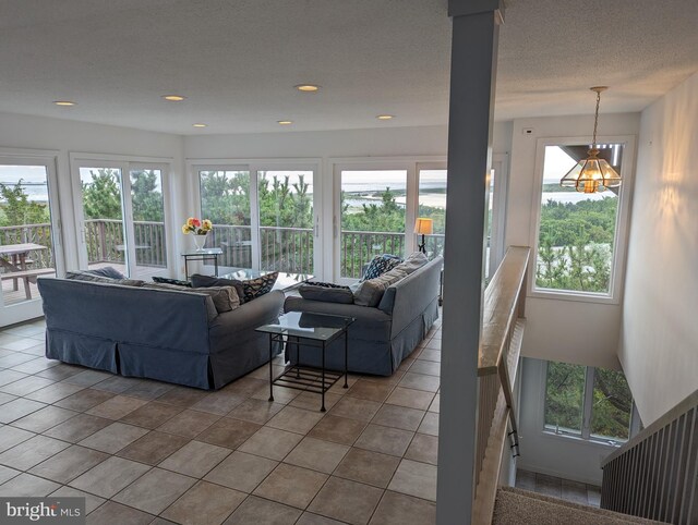 tiled living room with a textured ceiling