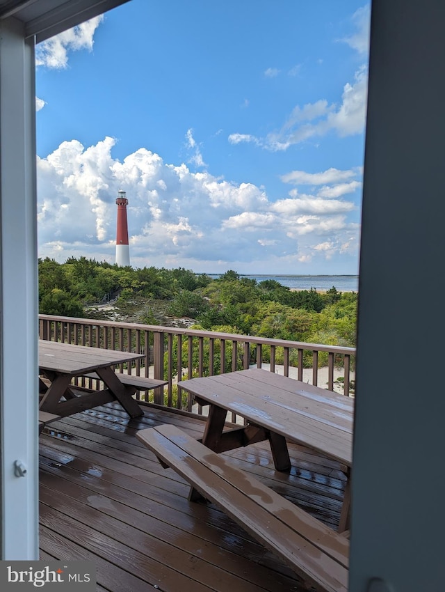 deck featuring a water view