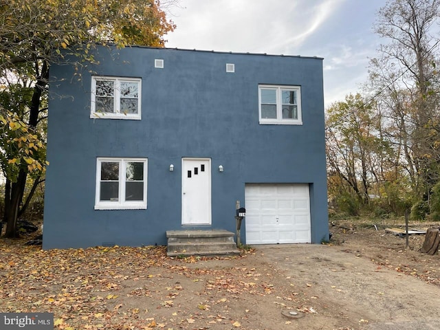 view of front of property with a garage