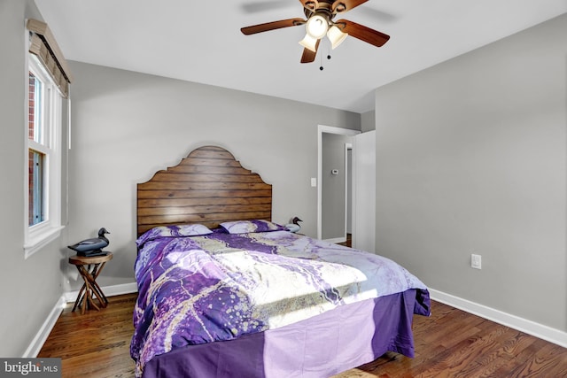 bedroom featuring dark wood-type flooring and ceiling fan