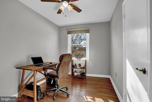 home office featuring hardwood / wood-style floors and ceiling fan