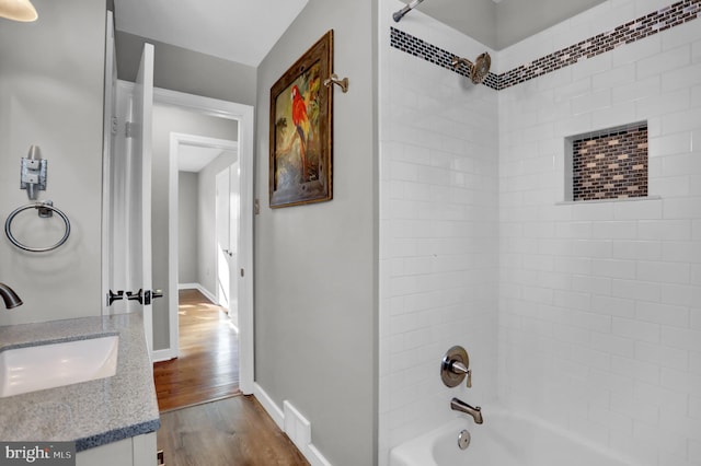 bathroom with vanity, tub / shower combination, and wood-type flooring