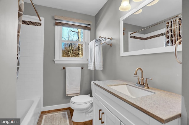 full bathroom with vanity,  shower combination, and toilet