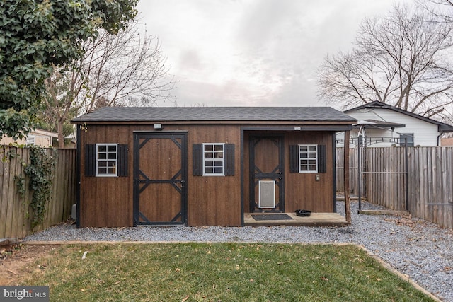 view of outdoor structure featuring a lawn