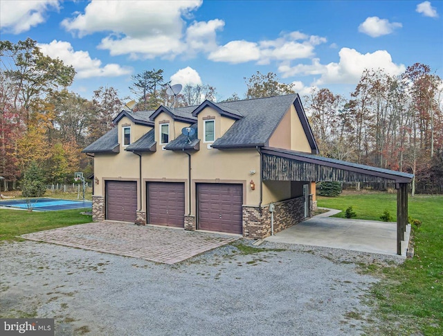 view of home's exterior featuring a garage and a lawn