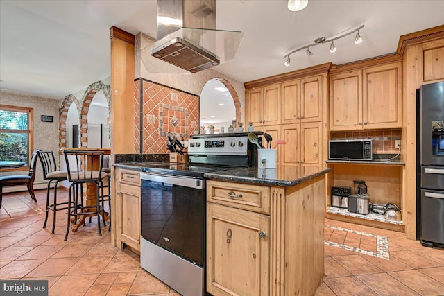 kitchen featuring appliances with stainless steel finishes, island range hood, light brown cabinetry, and light tile patterned flooring