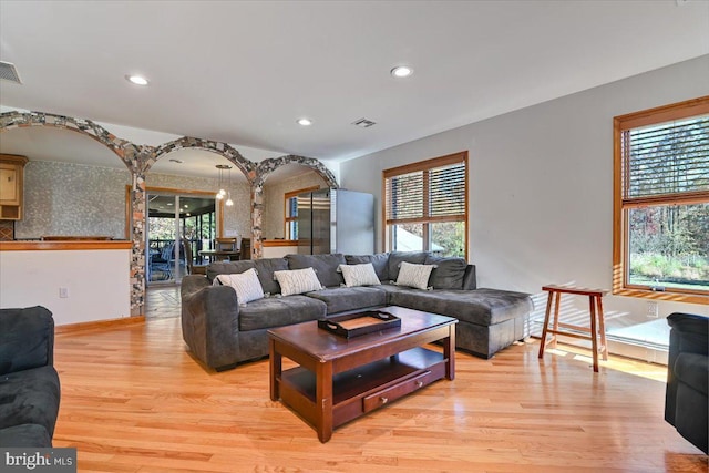 living room with light hardwood / wood-style floors