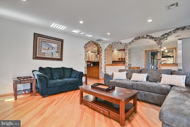 living room with light hardwood / wood-style floors