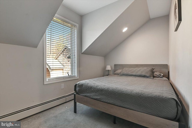 bedroom featuring carpet, lofted ceiling, and a baseboard heating unit