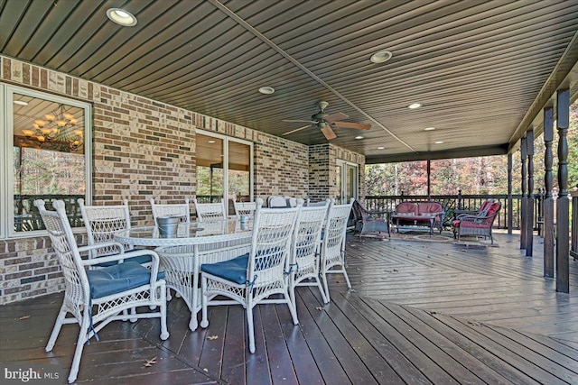 wooden deck featuring ceiling fan