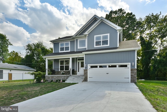 craftsman house with a garage, covered porch, and a front yard