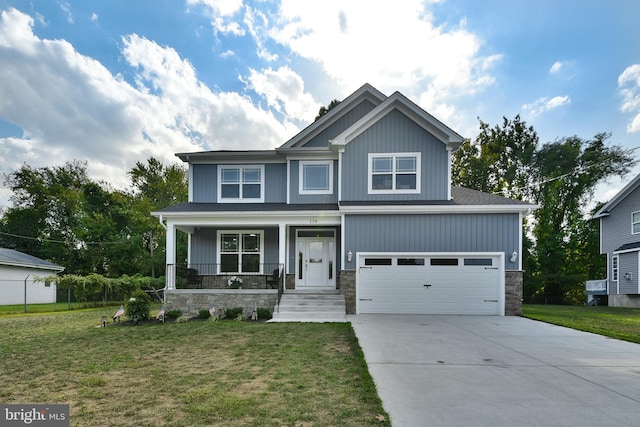 craftsman-style home with a front lawn, a porch, and a garage