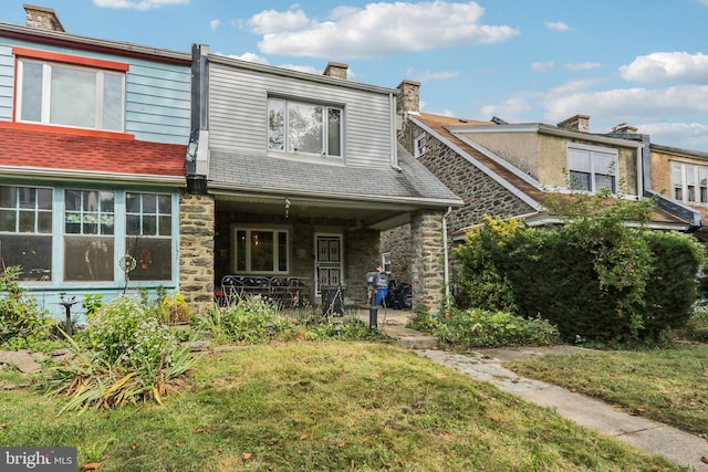 view of property with a front lawn