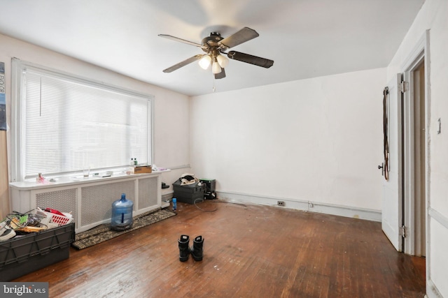 spare room featuring dark hardwood / wood-style floors and ceiling fan