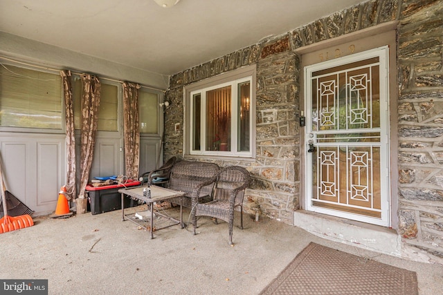 doorway to property with covered porch