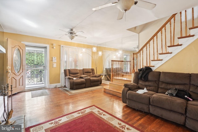 living room featuring hardwood / wood-style flooring and ceiling fan