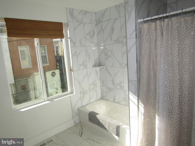 bathroom with shower / bath combination with curtain