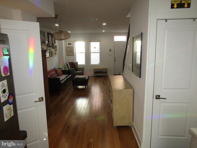 hall with dark wood-type flooring