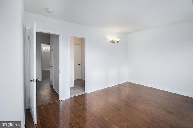 spare room featuring dark hardwood / wood-style floors