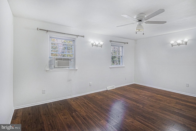 unfurnished room with ceiling fan and dark hardwood / wood-style flooring