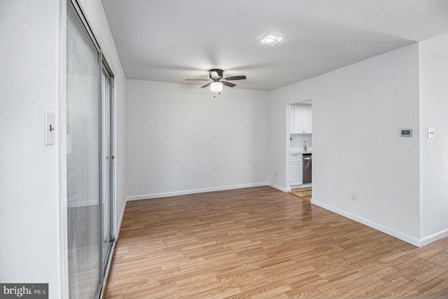 unfurnished room with light hardwood / wood-style floors and ceiling fan