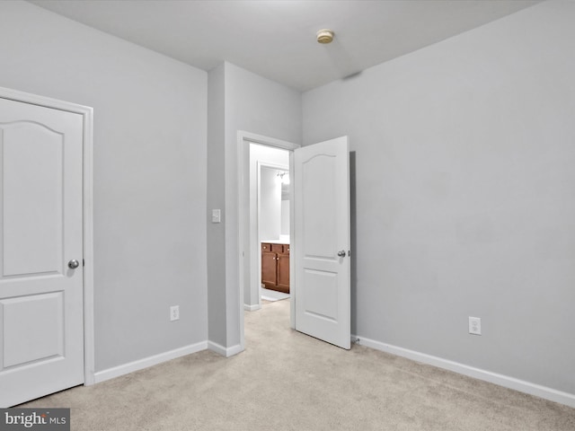 unfurnished bedroom with light carpet