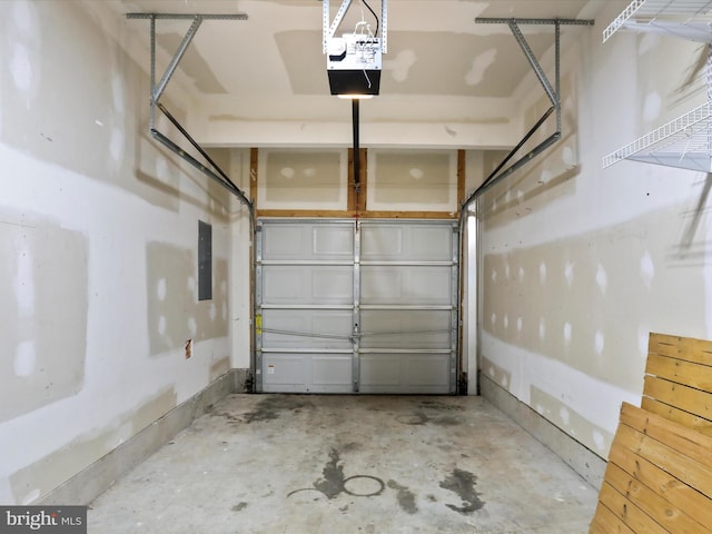 garage with electric panel and a garage door opener