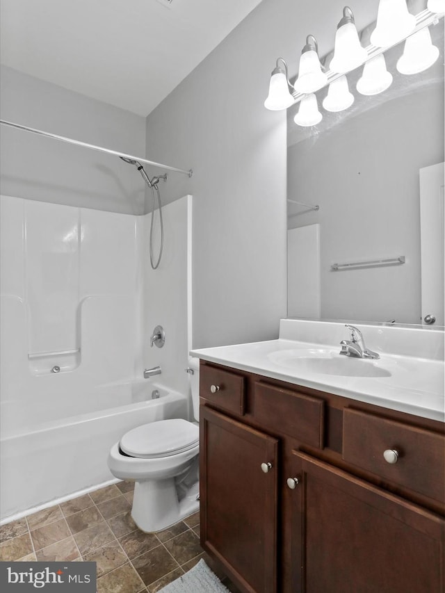 full bathroom with bathing tub / shower combination, vanity, and toilet