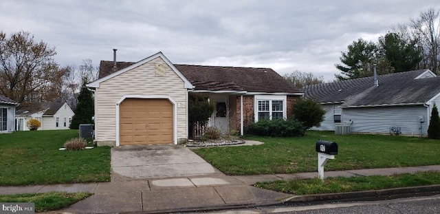 ranch-style house with a front yard, a garage, and cooling unit