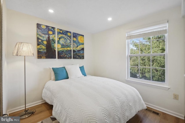 bedroom featuring hardwood / wood-style flooring