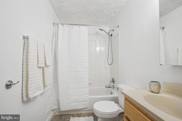 full bathroom with shower / bathtub combination with curtain, vanity, a textured ceiling, and toilet