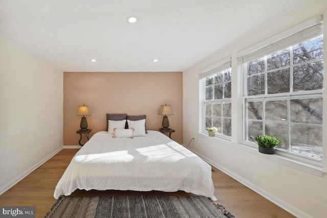 bedroom with hardwood / wood-style flooring