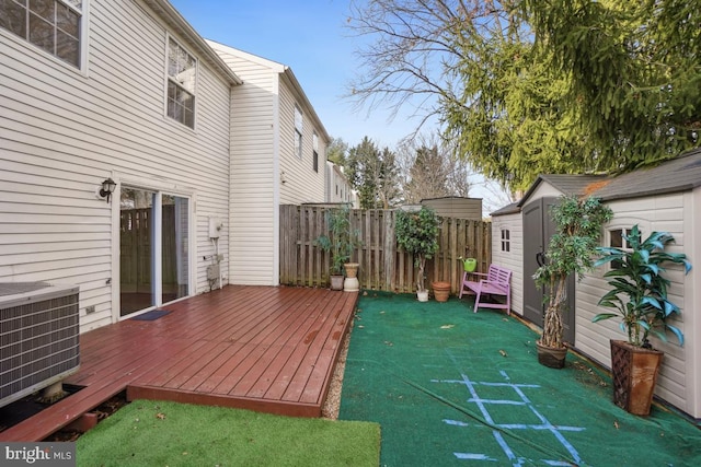 deck with central AC and a storage shed