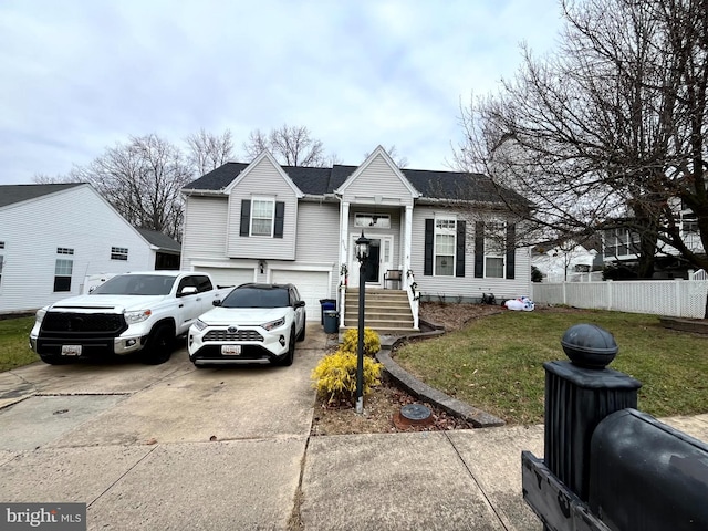 view of front of home featuring an attached garage, concrete driveway, a front lawn, and fence