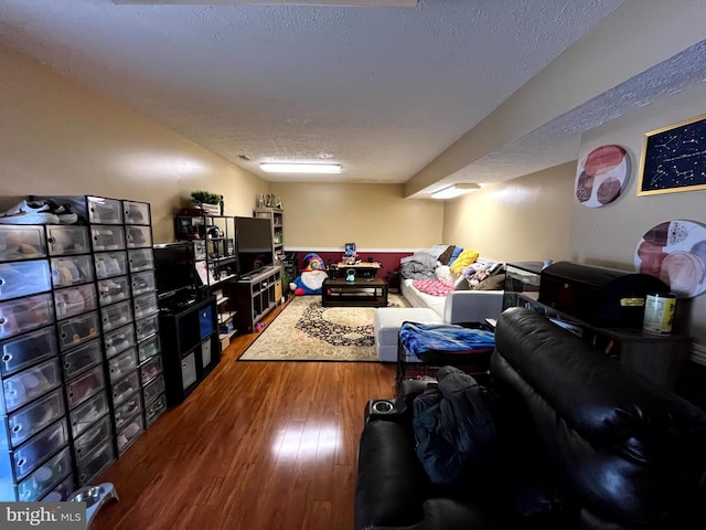 living room with wood finished floors and a textured ceiling