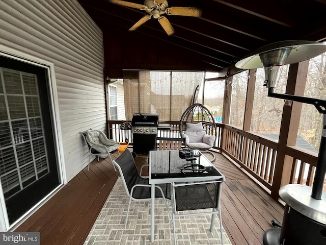 wooden deck with a grill and ceiling fan